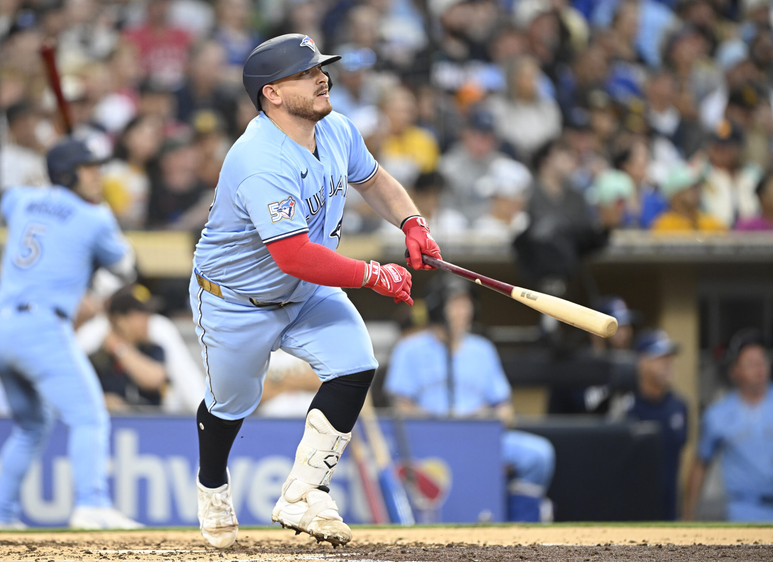 Jul 10, 2026; San Diego, California, USA; Toronto Blue Jays catcher Alejandro Kirk (30) hits an RBI double during the fourth inning against the San Diego Padres at Petco Park. Mandatory Credit: Denis Poroy-Imagn Images