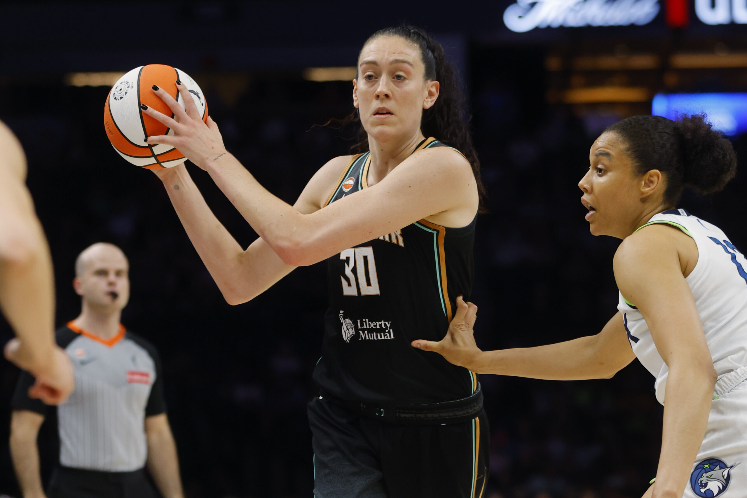 Jul 11, 2026; Minneapolis, Minnesota, USA; New York Liberty forward Breanna Stewart (30) looks for a pass as Minnesota Lynx forward Nia Coffey (12) defends her in the first quarter at Target Center. Mandatory Credit: Bruce Kluckhohn-Imagn Images