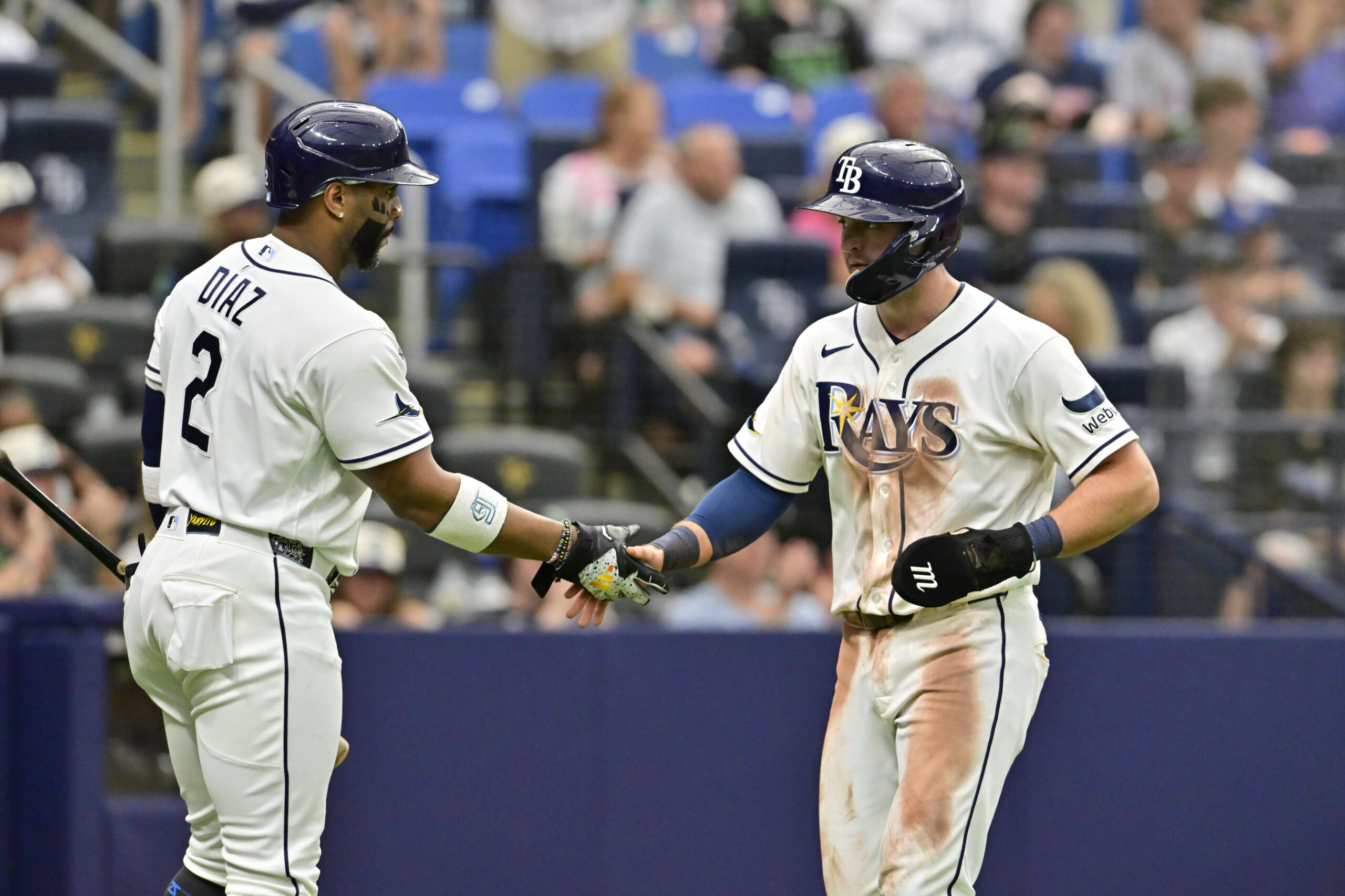 Jul 11, 2026; St. Petersburg, Florida, USA; Tampa Bay Rays second baseman Ben Williamson (15) celebrates a run with teammate designated hitter Yandy Diaz (2) during the eighth inning against Seattle Mariners at Tropicana Field. Mandatory Credit: Pablo Robles-Imagn Images