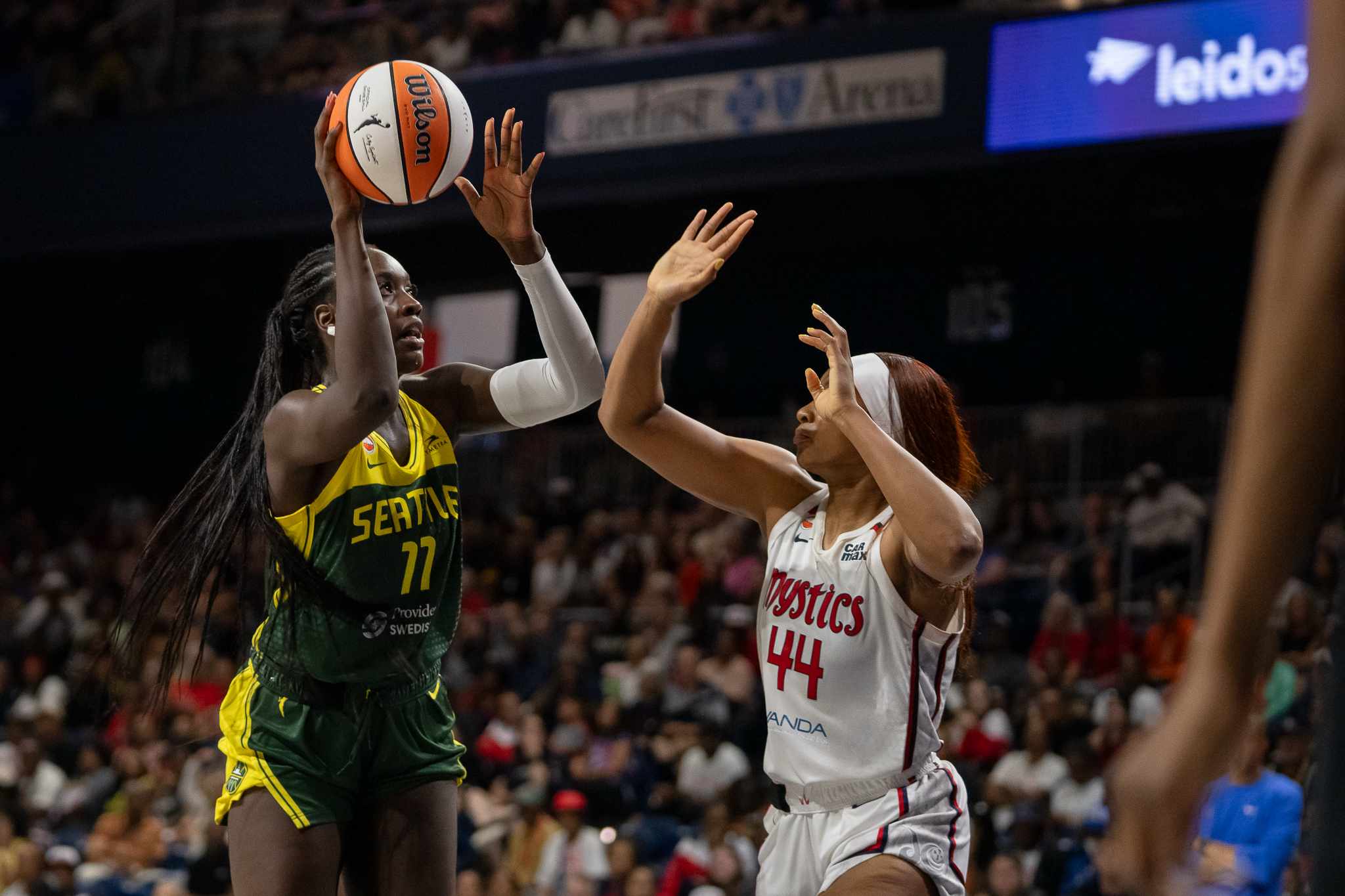 Jul 12, 2026; Washington, District of Columbia, USA; Seattle Storm Center Awa Fam (11) attempts a shot against Washington Mystics Forward Kiki Iriafen (44) in the fourth quarter at CareFirst Arena. Mandatory Credit: Jamie LeBlanc-Imagn Images