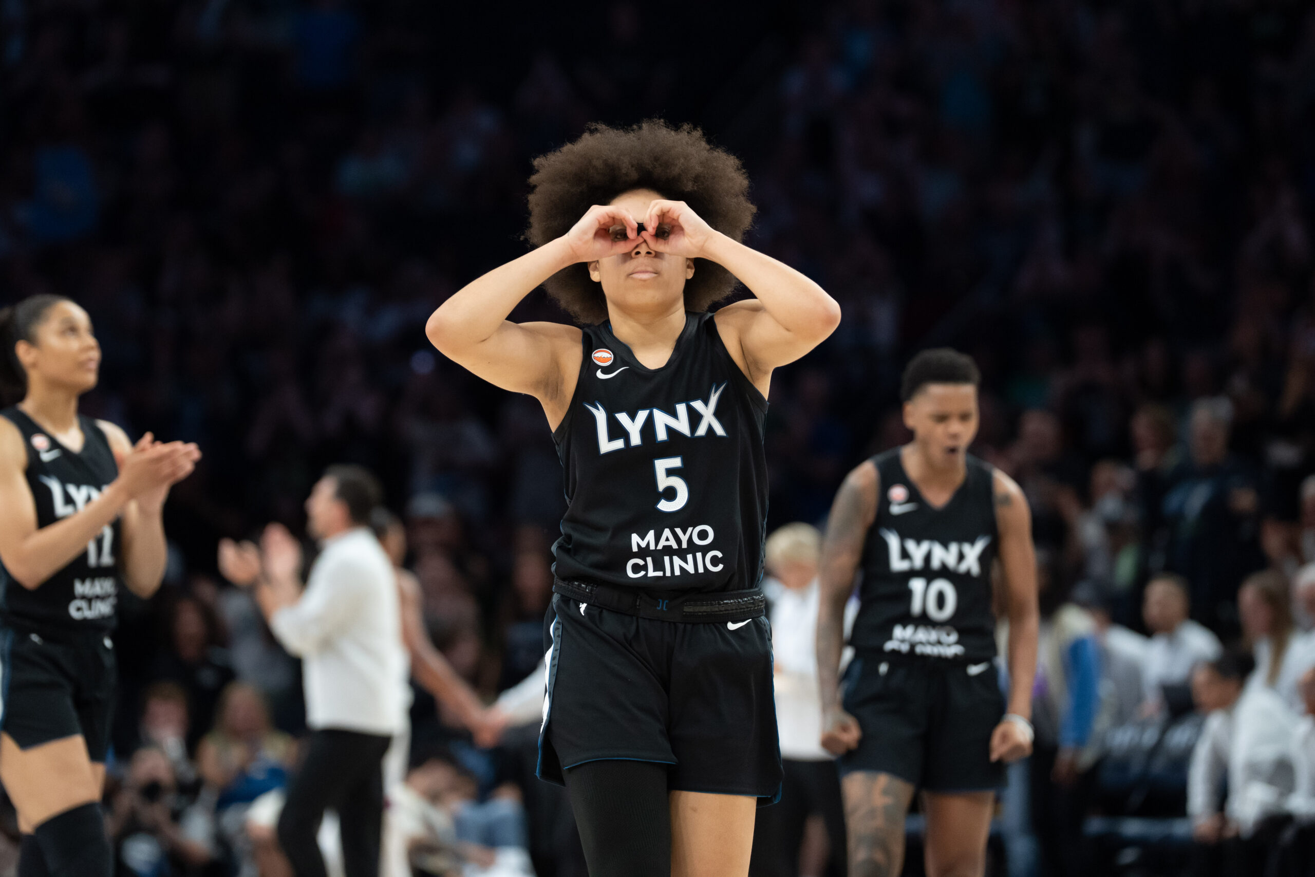 Jul 13, 2026; Minneapolis, Minnesota, USA; Minnesota Lynx guard Olivia Miles (5) celebrates making a go ahead three point shot against the Phoenix Mercury in the second half at Target Center. Mandatory Credit: Jesse Johnson-Imagn Images